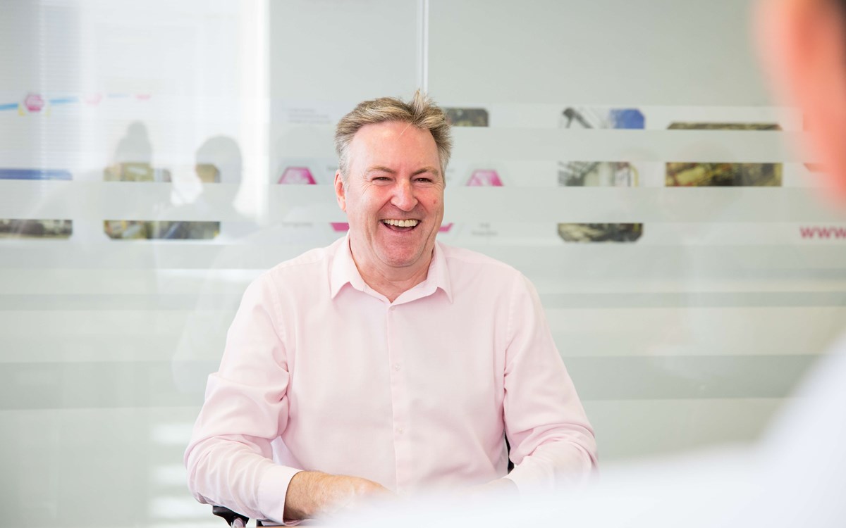 sharing a joke in the boardroom