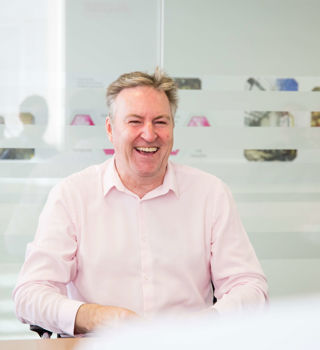 Ken Laughing Boardroom Image