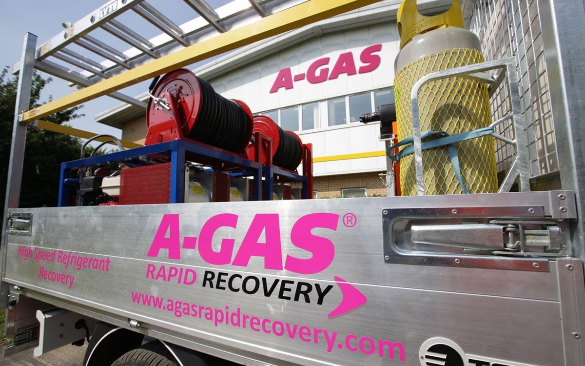 The metal side of an A-Gas Rapid Recovery truck with the pink and black logo