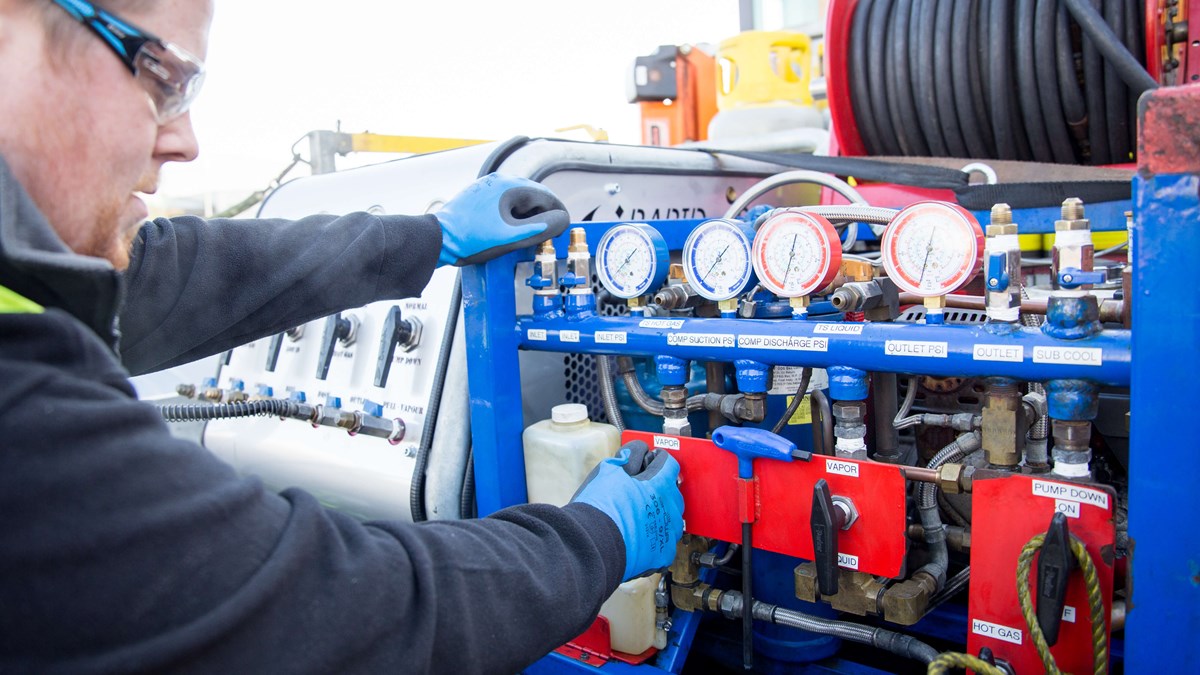 service engineer operating recovery equipment