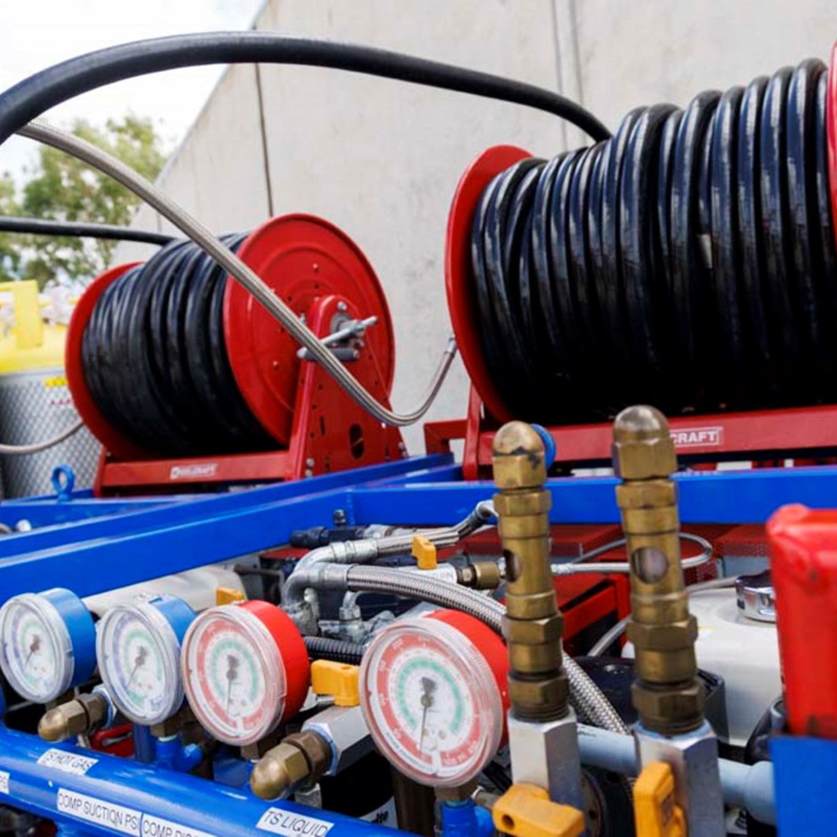 Rolls of black wire on top of blue recovery equipment