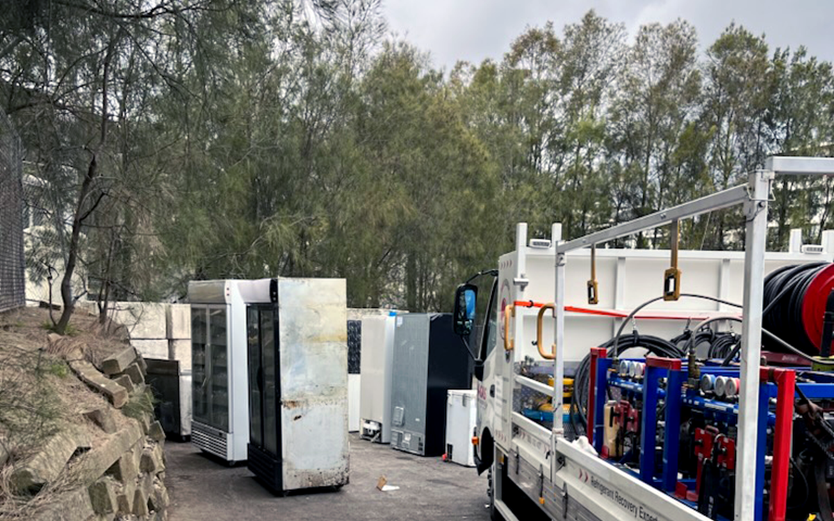 White A-Gas van entering a scrapyard