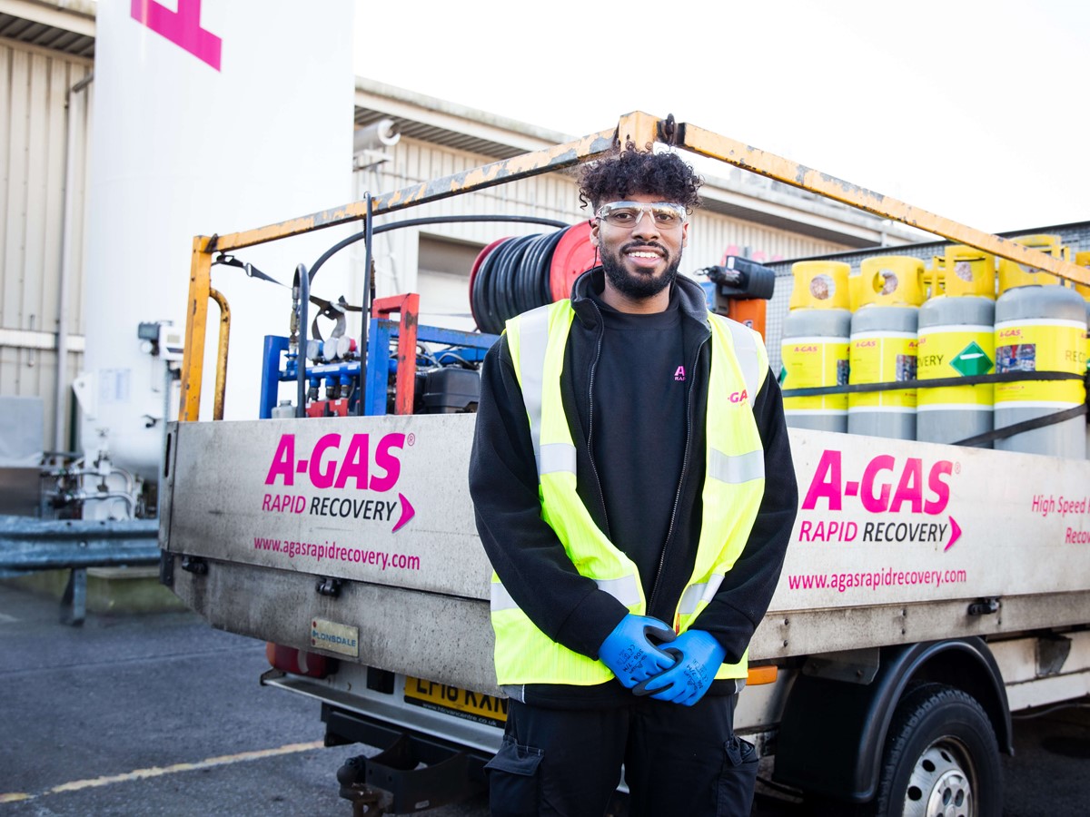 recovery engineer standing in front of service vehicle