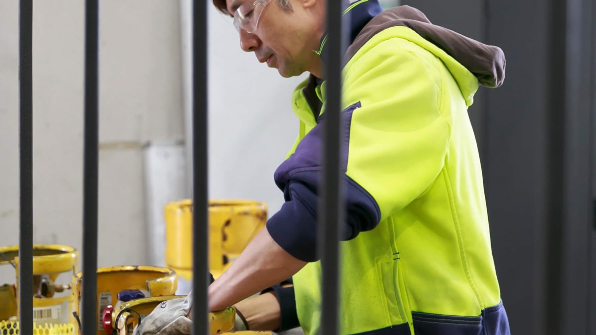 cylinder technician in protective glasses