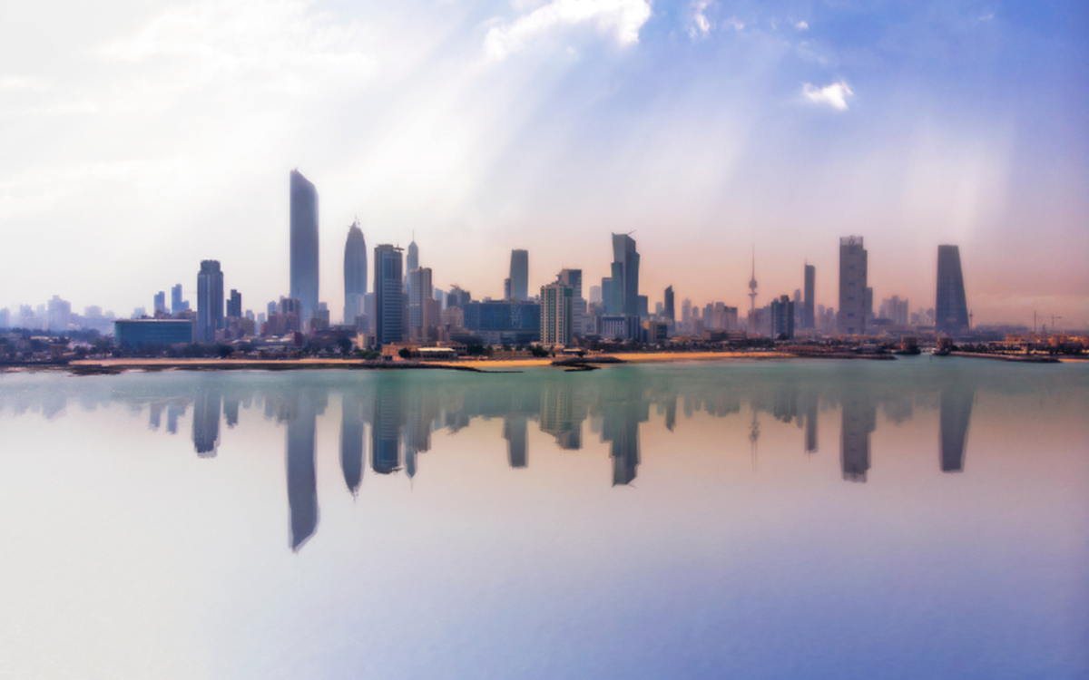 Skyline of a city behind a body of water