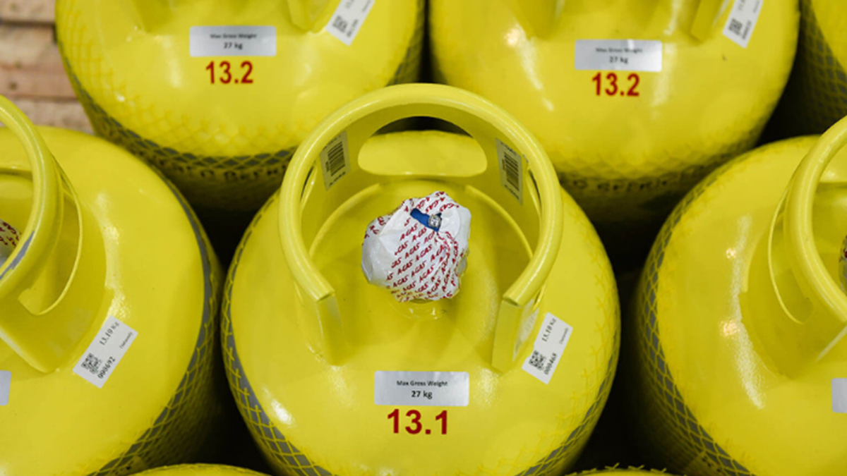 A shot of grey cylinders with yellow tops from above