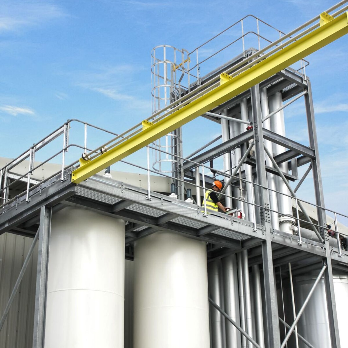 Wide angle shot of a person working on a raised platform above a separator