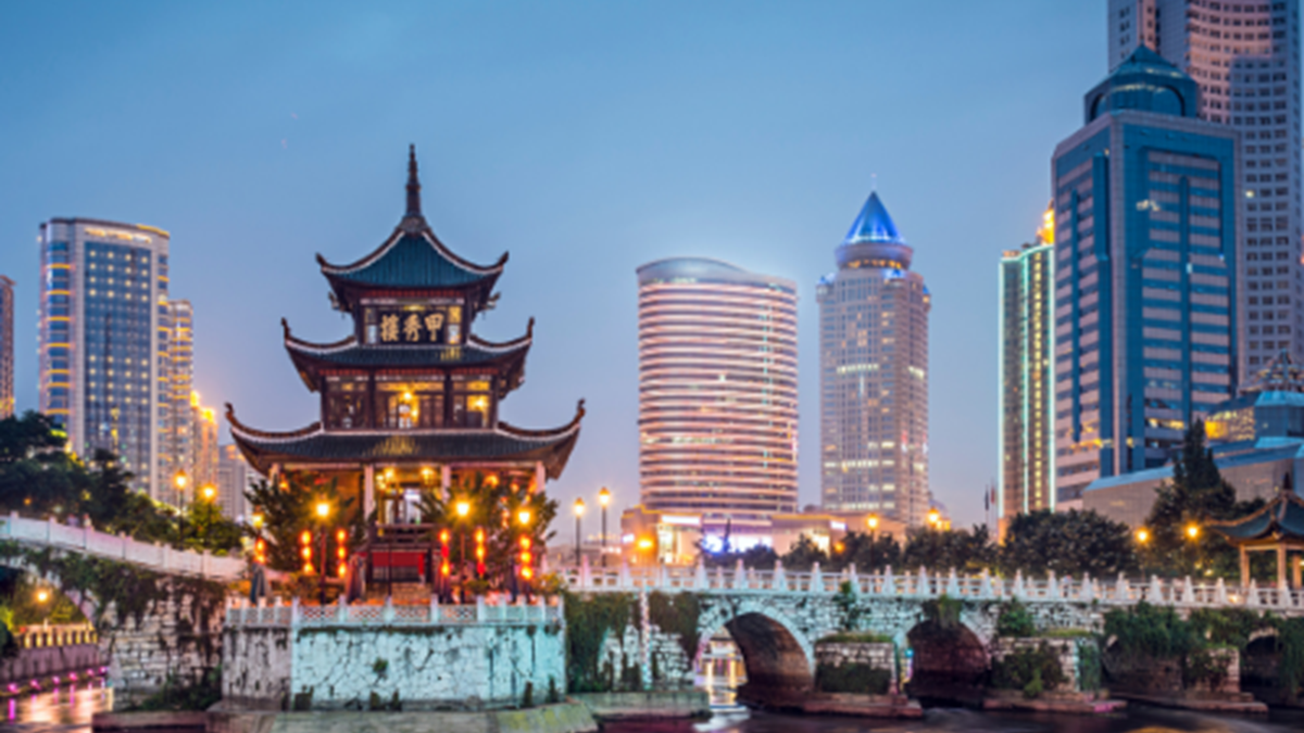 An image of China with traditional buildings on the water