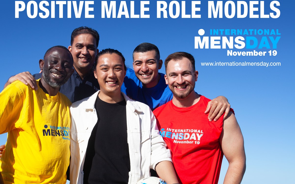 A group of men on a poster with International Men's Day logo