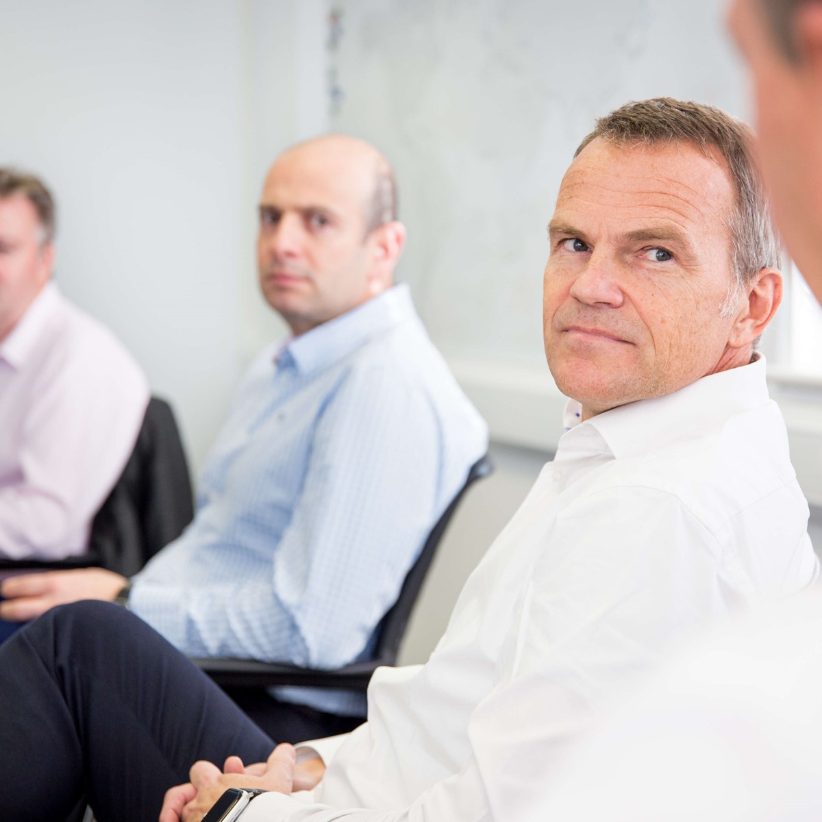 seated boardroom meeting