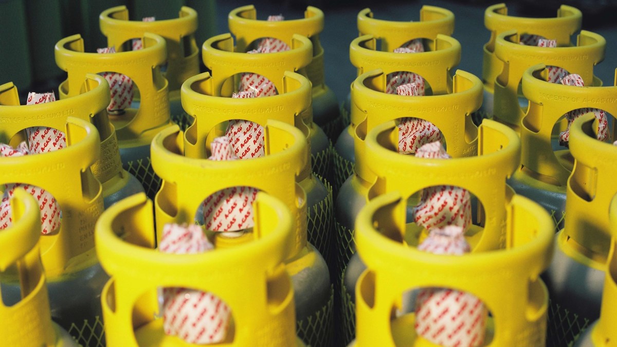 Rows of Recovery cylinders lined up, they have yellow cylinder tops