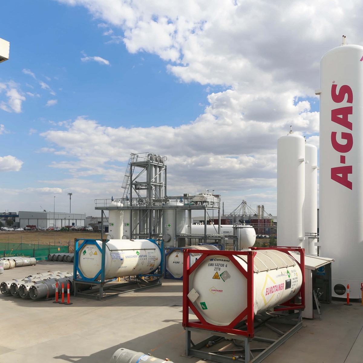 The A-Gas Australia site from a wide angle above shot, there are A-Gas branded industrial cylinders in the foreground of the image