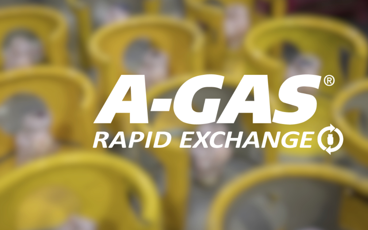 White text on a blurred background of cylinders with yellow tops