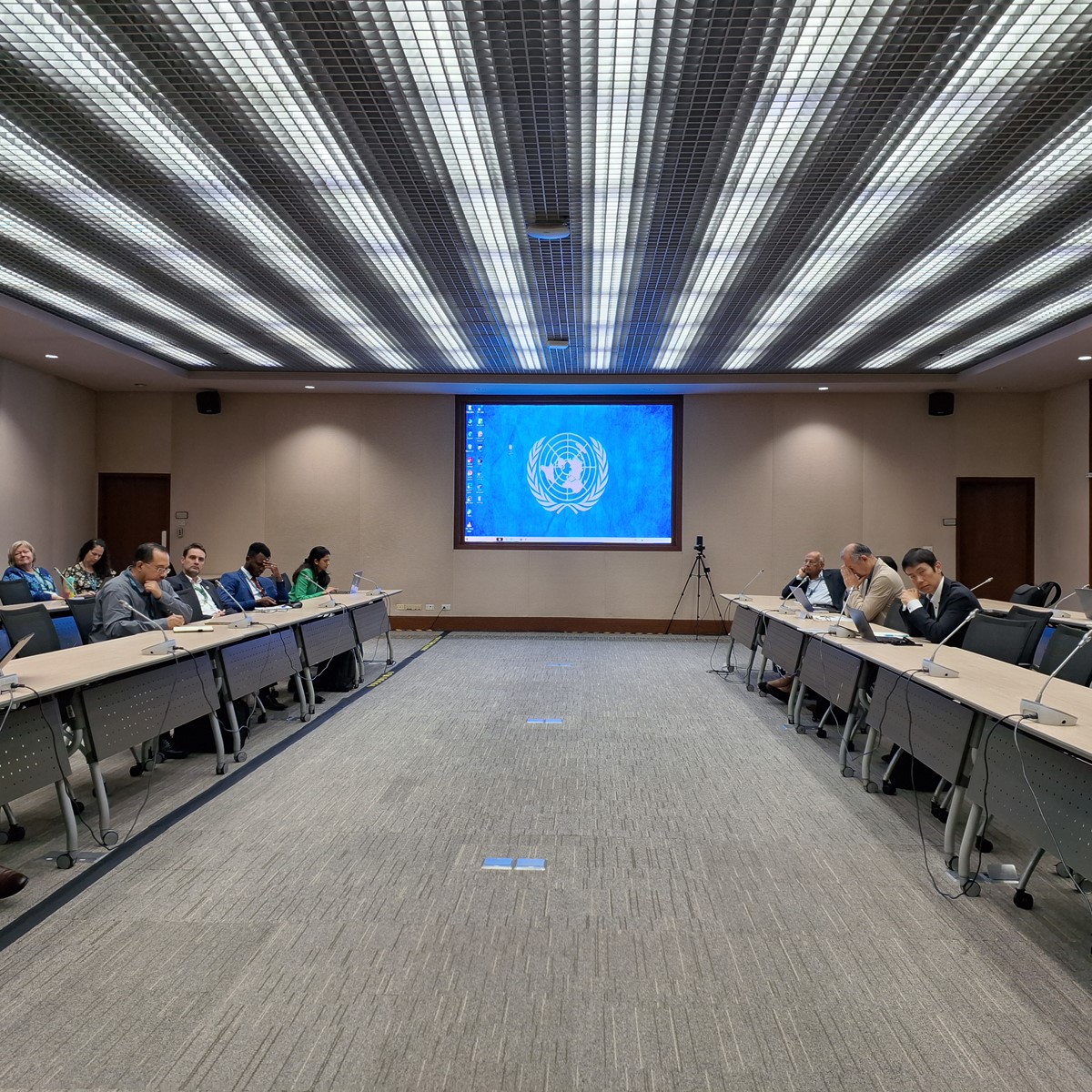 People sitting and attending a conference in an office