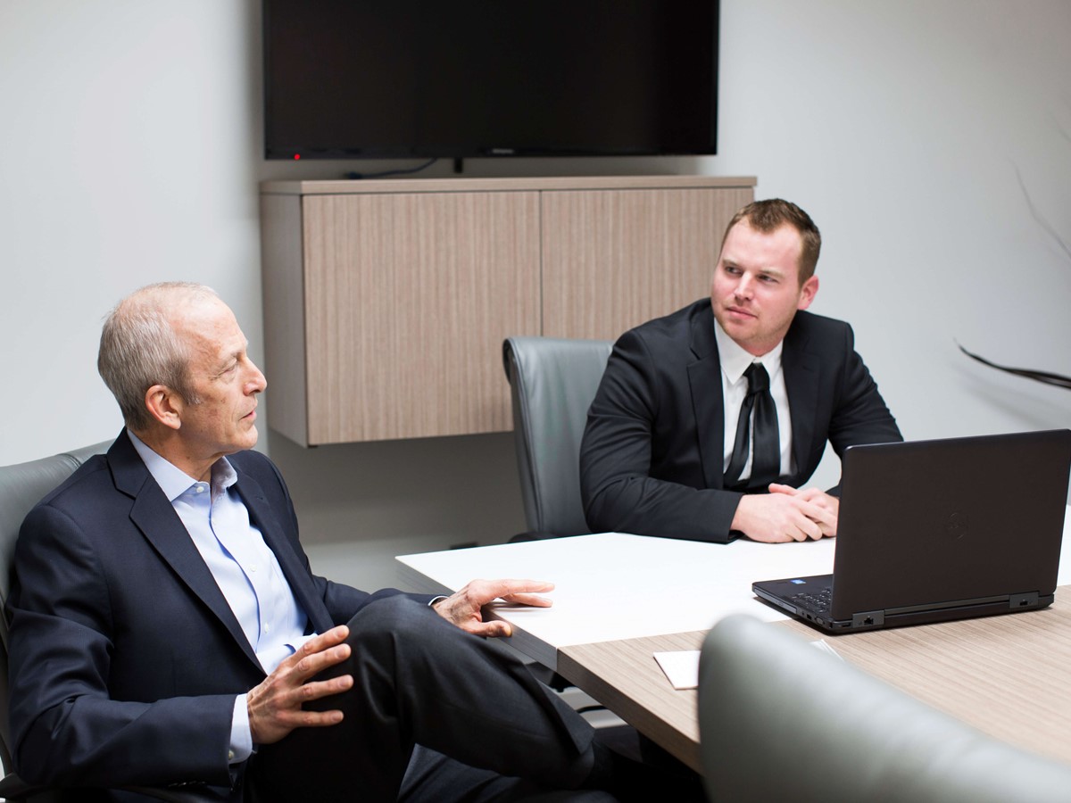 2 suited executives in a meeting