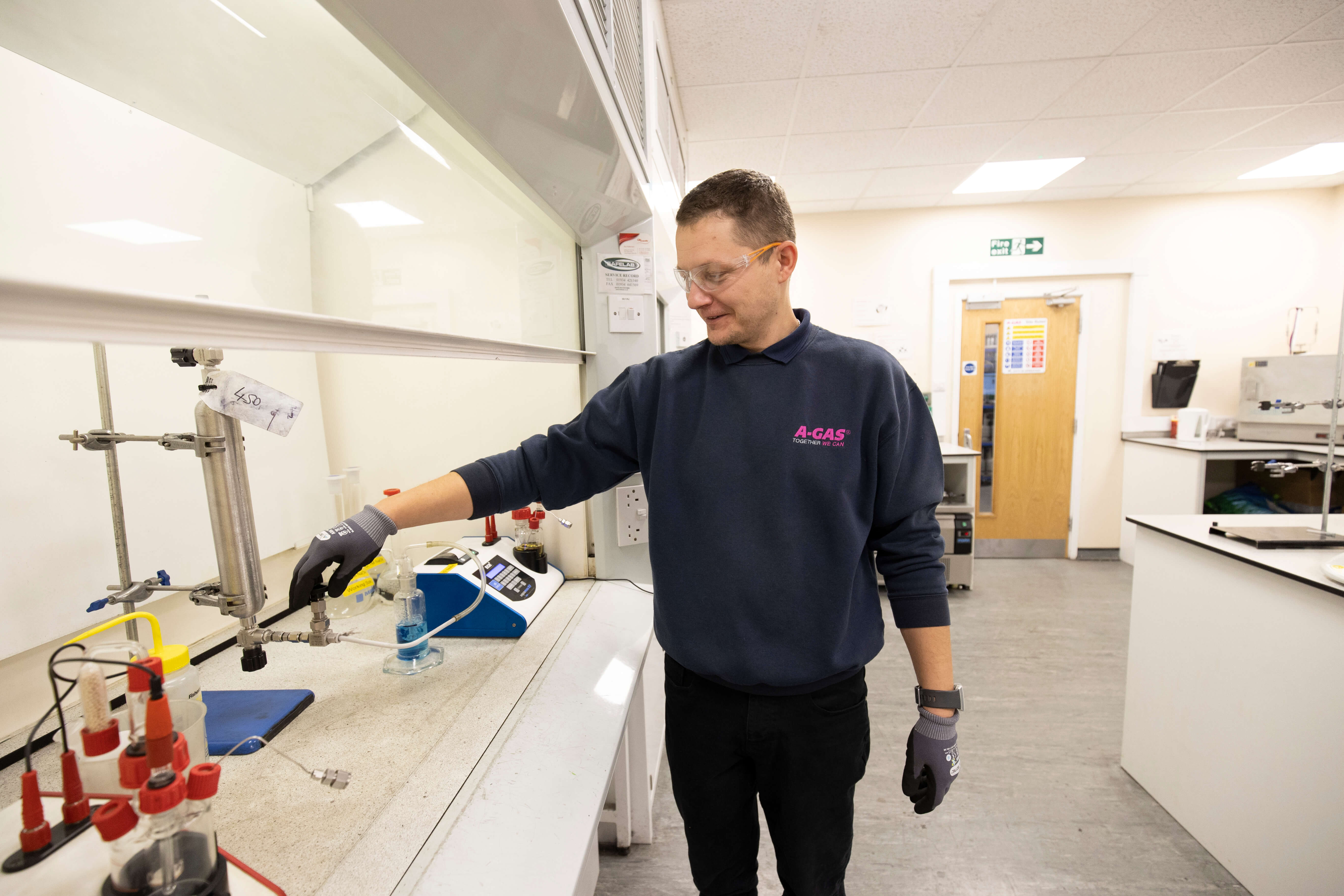 lab technician preparing analysis equipment