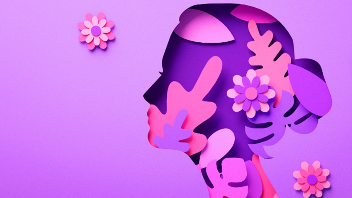 A light purple tile with an artistic depiction of a woman's head with pink flowers and trees