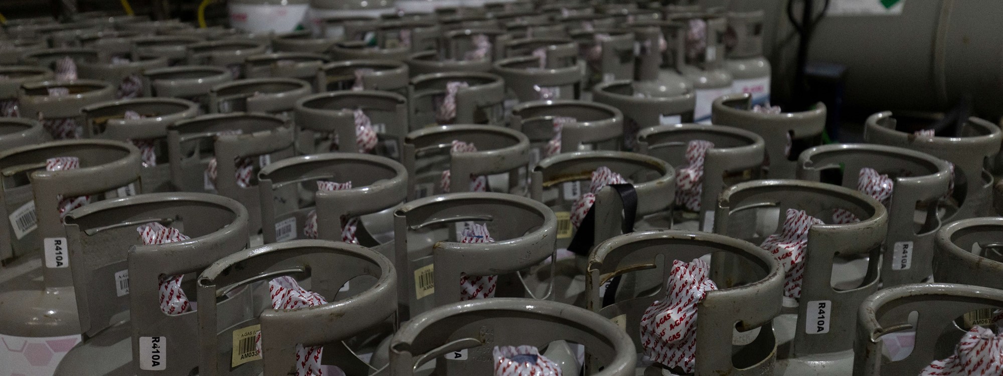 a warehouse floor of industrial gas cylinders
