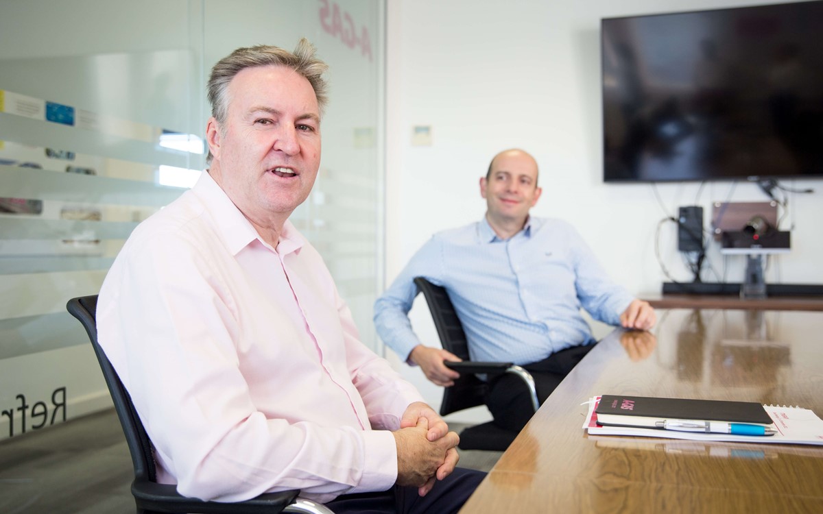 executives in boardroom discussion