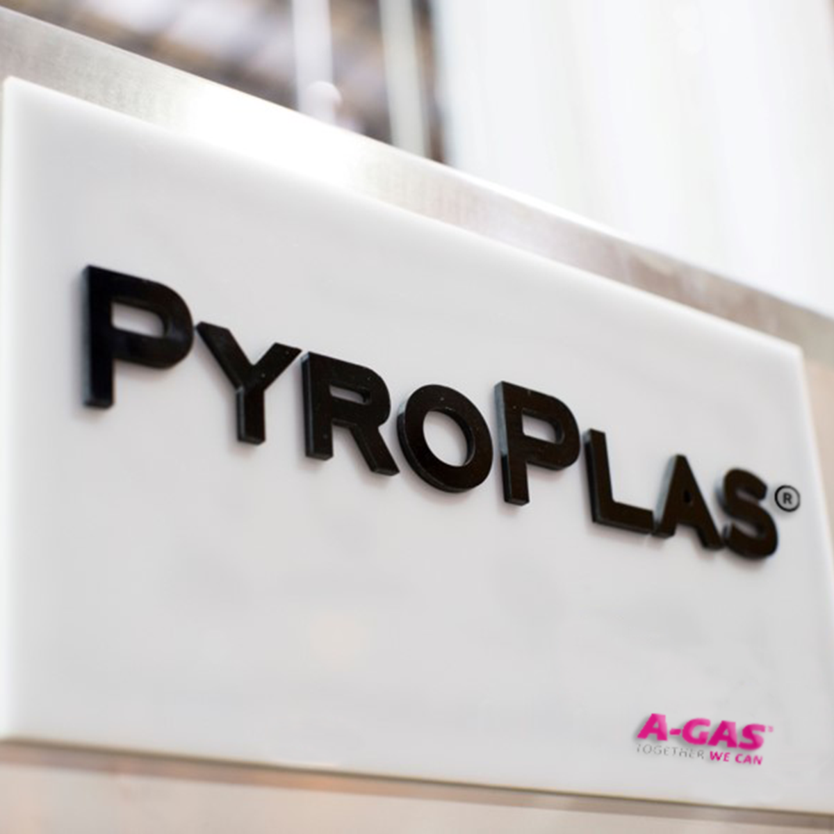 An image of a white sign with PyroPlas and the A-Gas logo on it